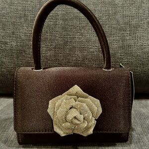 Elegant Black Handbag with Silver Floral Accent